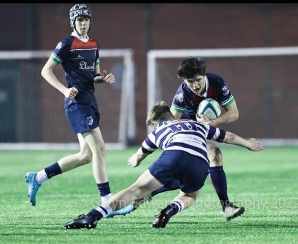 Ashley shows his rugby skills