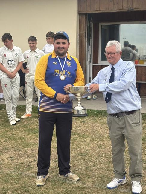 George Smith, captain of Pem Dock - receives the trophy from Martin Jones