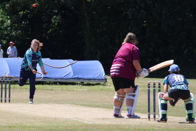 Sam Rossiter bowls to Ffion Ashman