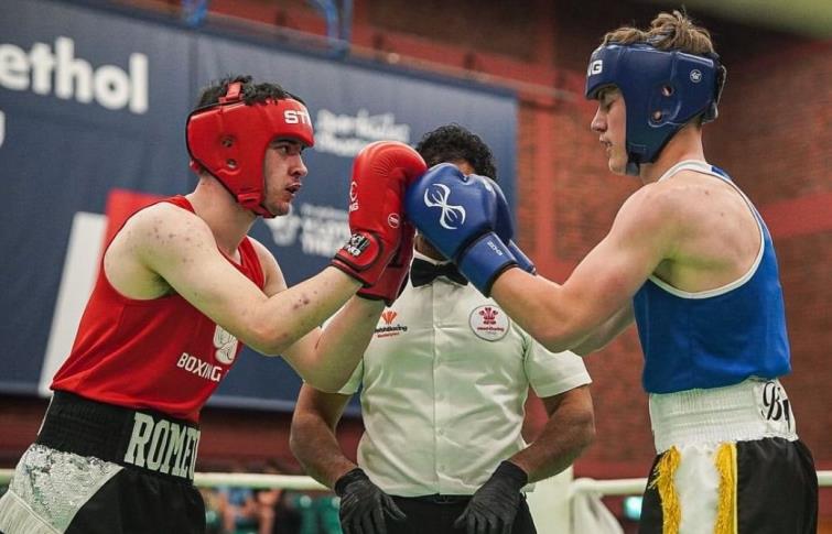 Sean (in blue) takes on a tough opponent in Romeo Maccarinelli
