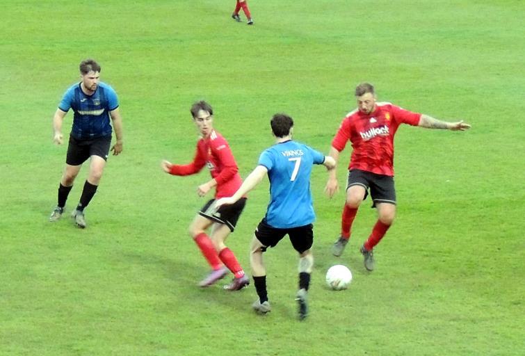 Leon Luby closes in on Iwan Izzard (Picture Bill Carne)