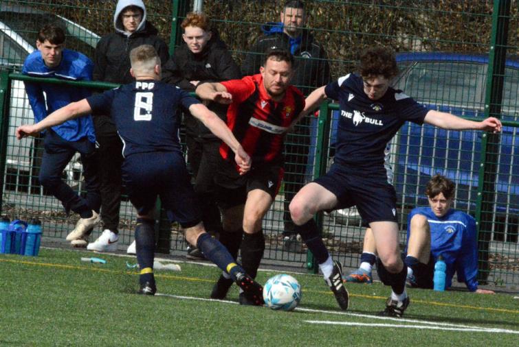Jonny Horgan tries to beat two Bridge defenders