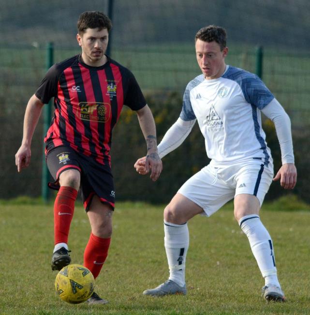 Scott Ferney closely marked by Anthony Couzens