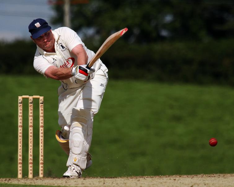 Simon Holliday hits a boundary