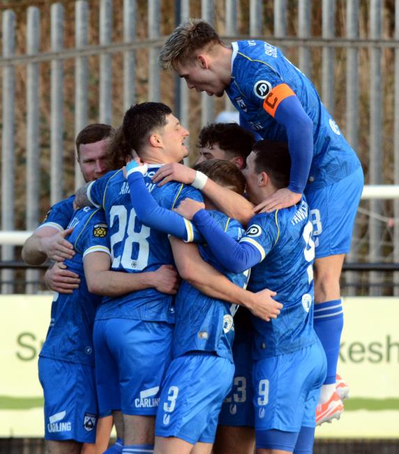 Haverfordwest County players celebrate scoring against Bala Town