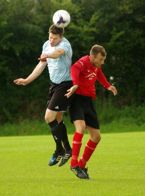 Henry Durrant wins this aerial battle for Neyland against Carew