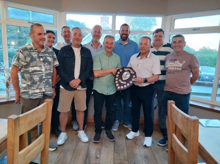 Colin Phillips (third right) presents the Reg Jones Memorial Shield to Andrew Twts Thomas