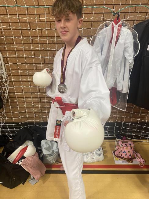 Connor John poses with his medal