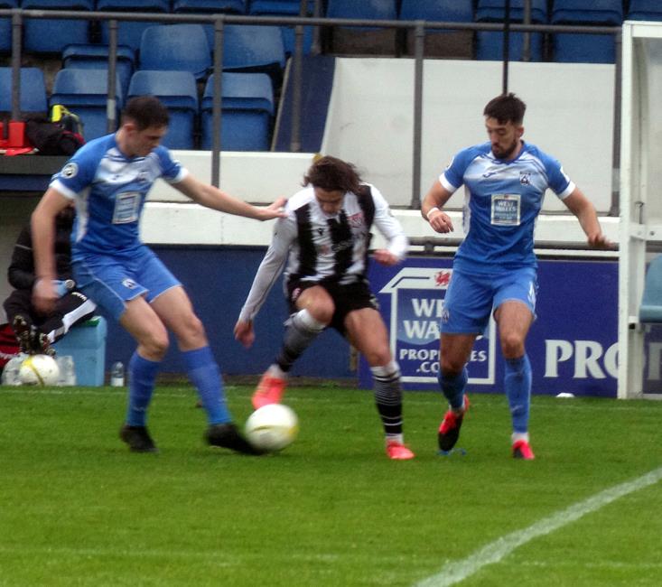 Callum Pratley works hard to keep possession for the Silkmen