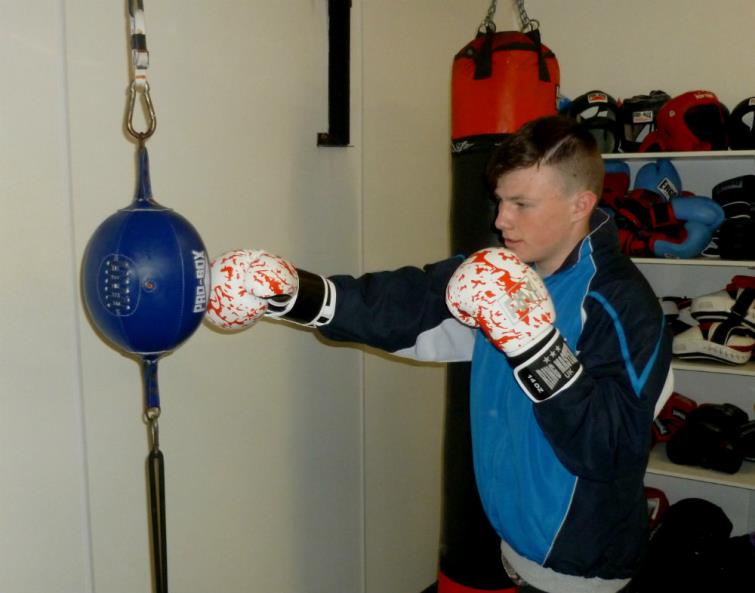 Cameron Barrows punching the ball