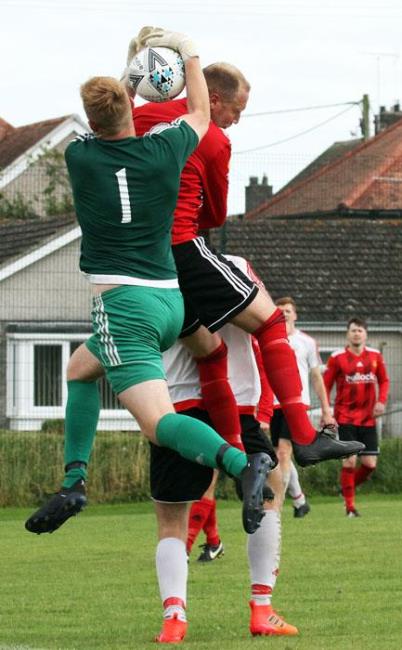 Jack Christopher competes in the air for Carew. Picture by Susan McKehon