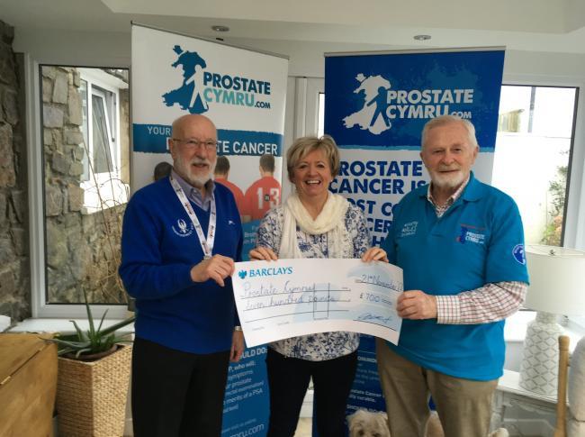 Charles Davies presenting a cheque to Prostate Cymru
