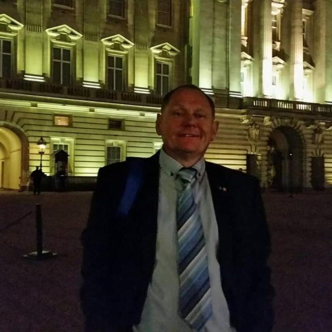 Outside Buckingham Palace in the evening