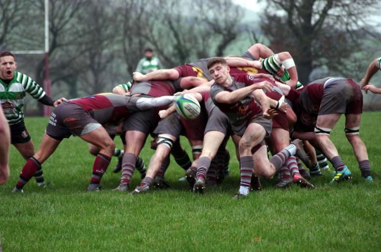 Crymych scrum half Adam Forster whips a pass from the base of scrum