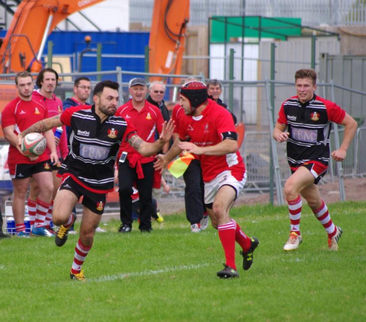 Milford outside half Craig Barnett races clear to score