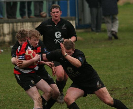 Andrew Slark makes a tackle for the All Blacks