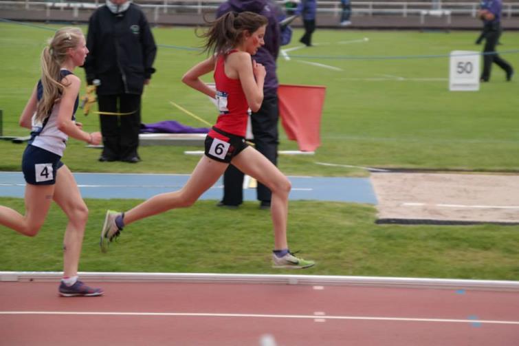 Abbie running on the track