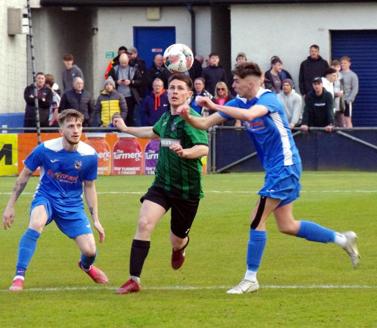 Monkton and Hakin compete for ball