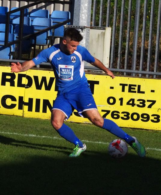 Ashley Bevan crosses into the box