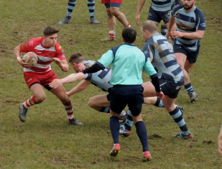 Emlyns Ashley Sutton is boxed in by keen Otter defence 