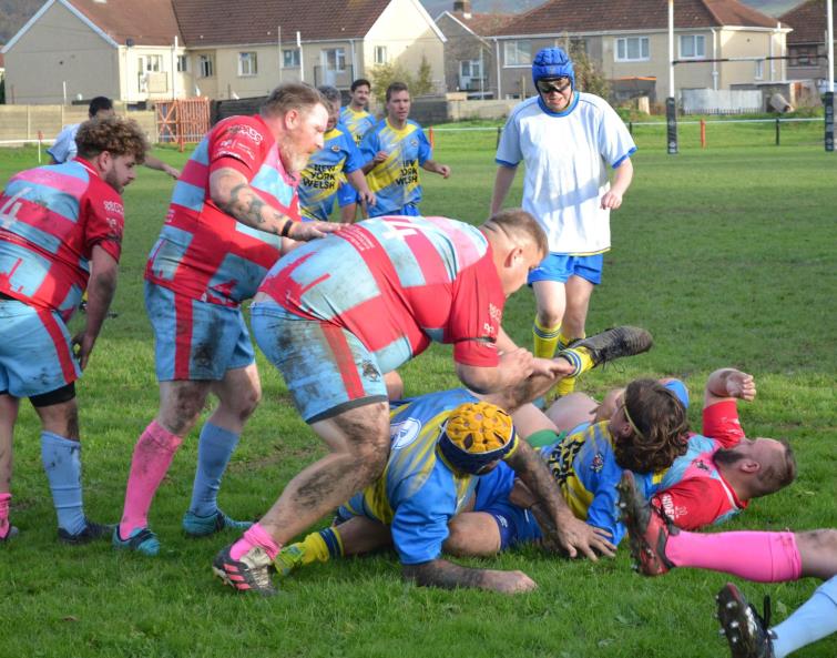 Both teams contest for the ball
