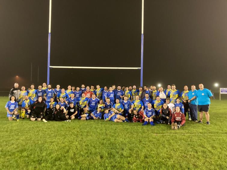Both teams share a photograph