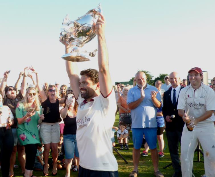Neilson Cole holds the Bowl aloft