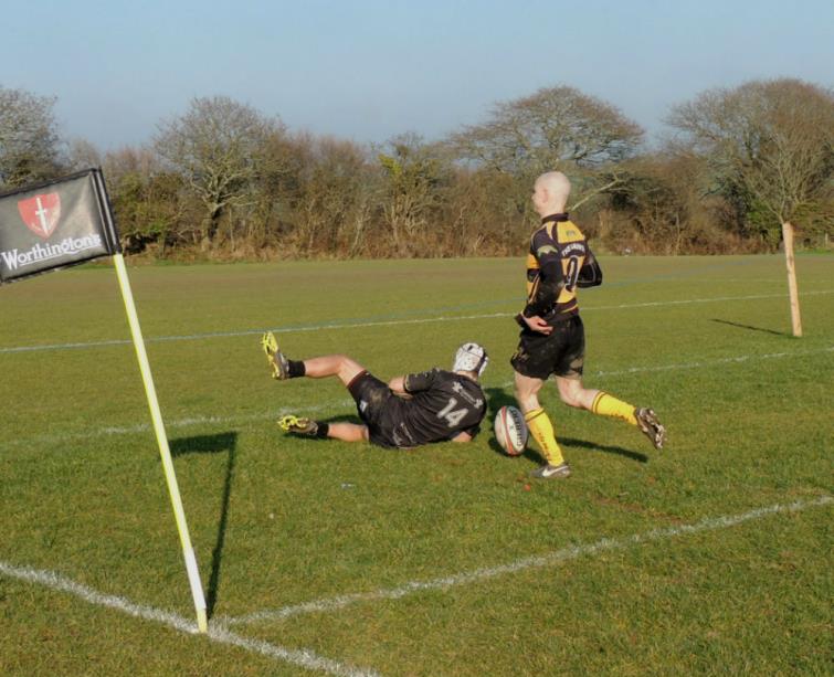 Ben Goodridge outpaces Fraser Watson to score