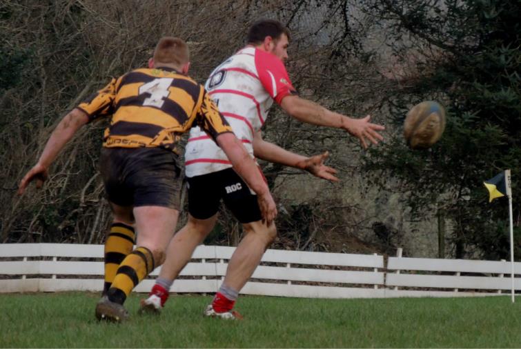 Ben Groves looks to slip a pass