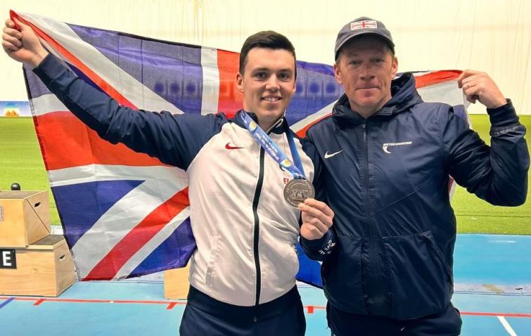 Flying the flag - Ben Llewellin shows off silver medal with coach Richard Brickell