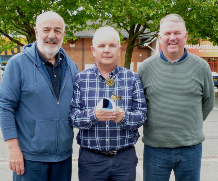 Bill Carne presents their award to Daisy Picton and Colin Fawcett 