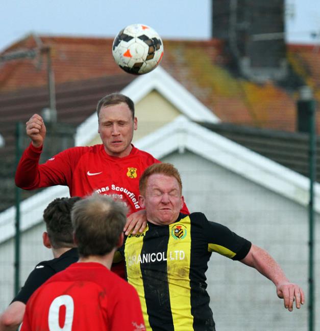 Carew’s Jack Christopher wins an aerial battle against Herbrandston