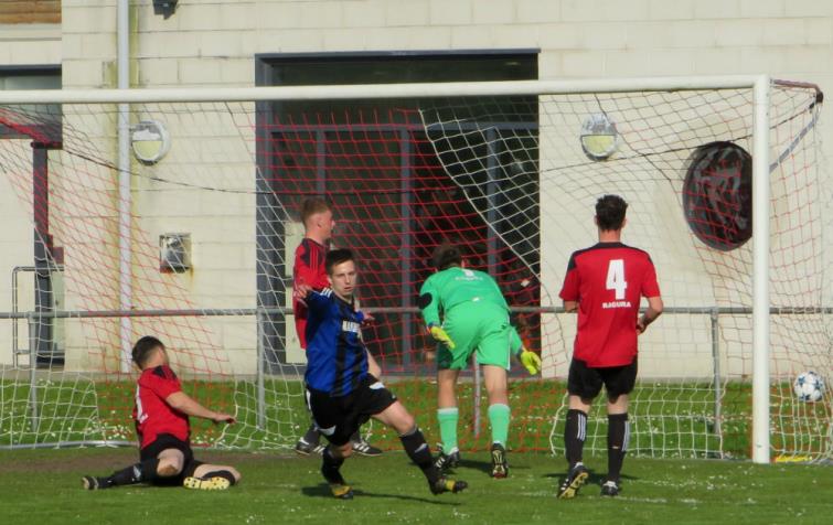 Justin Harding celebrates scoring for Hakin United