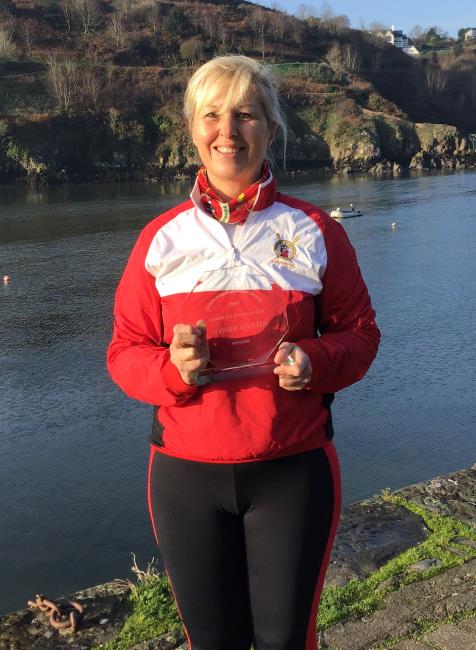 Gaynor Martin proudly displays her award