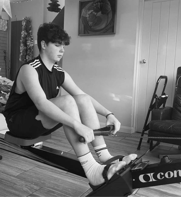 Gabriel training on rowing machine