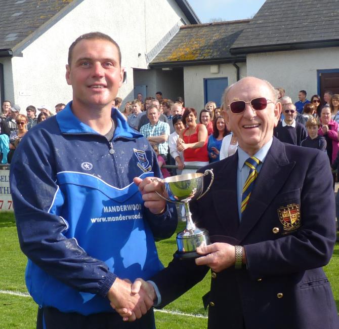 Royston presenting his award to Hakin manager Gary Dawes