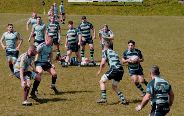Lewys Gibby gets the ball out wide