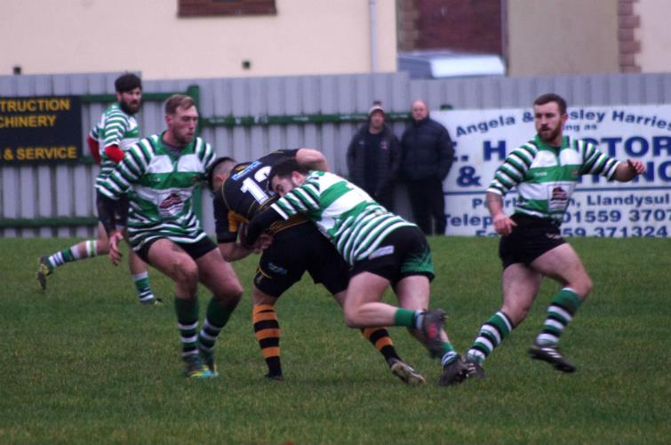 Gino Setaro puts in a strong tackle