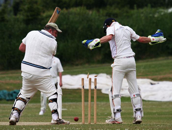 Greg Sleep loses his wicket to the bowling of Shaun  Whitfield