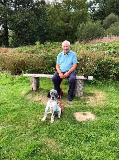 Gwyn French relaxing with his dog