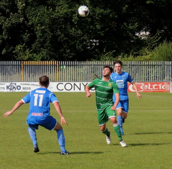 Kristian Speake and Alaric Jones keep their eyes fixed on the ball