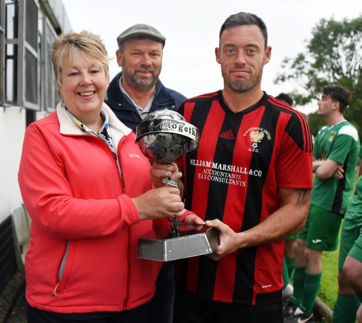 Goodwick skipper Rob Couzens receives the cup