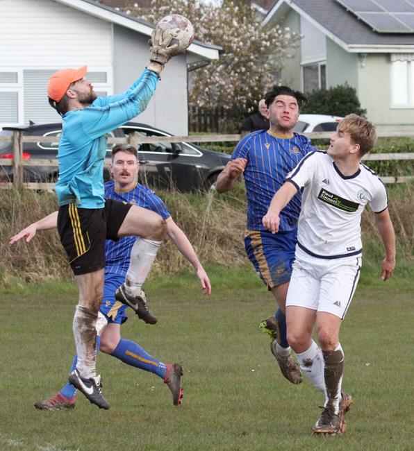 Keeper Richard Tebbutt gathers under pressure by Kilgetty goal scorer Richard Tebutt.Picture Susan McKehon
