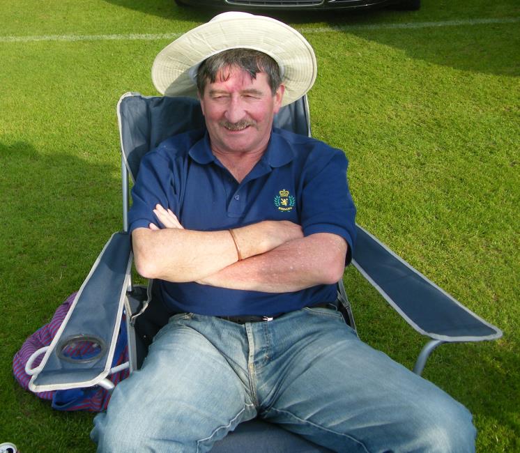 Dai John watching cricket from the boundary