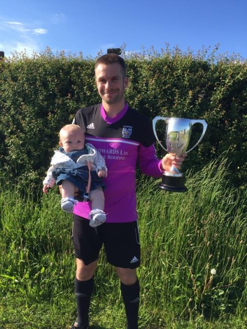 Dan Bellis with baby and cup