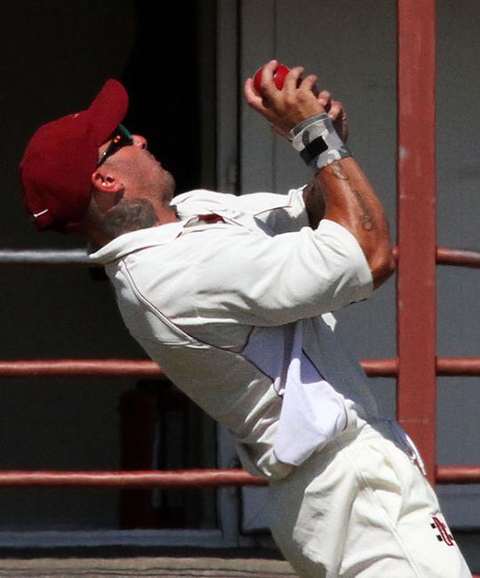 Dan Sutton takes a superb catch to dismiss Adam James
