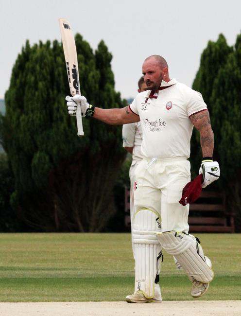 Dan Sutton celebrates his century