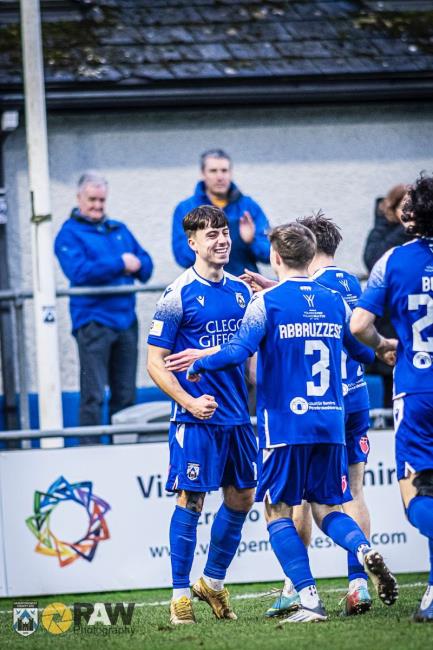 Daniel Hawkins and teammates celebrate opening goal