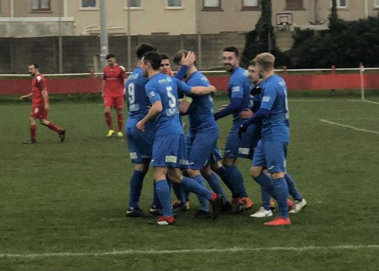 Haverfordwest County players congratulate skipper Sean Pemberton who has scored six goals on the trot