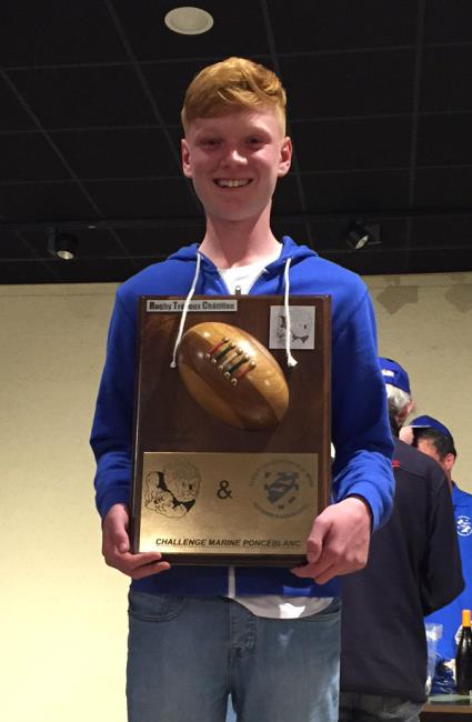 Dylan Phillips receives an award